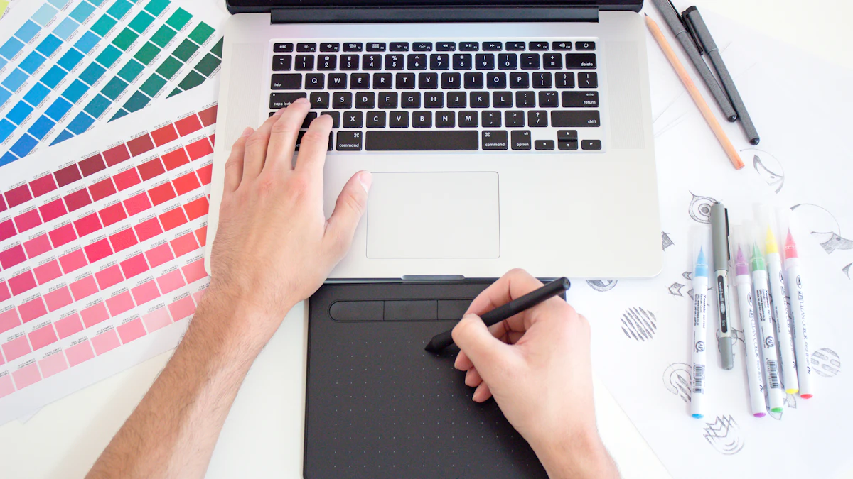3D illustration of a designer workspace with a monitor showing creative artwork, a color palette, a pen tool and shapes