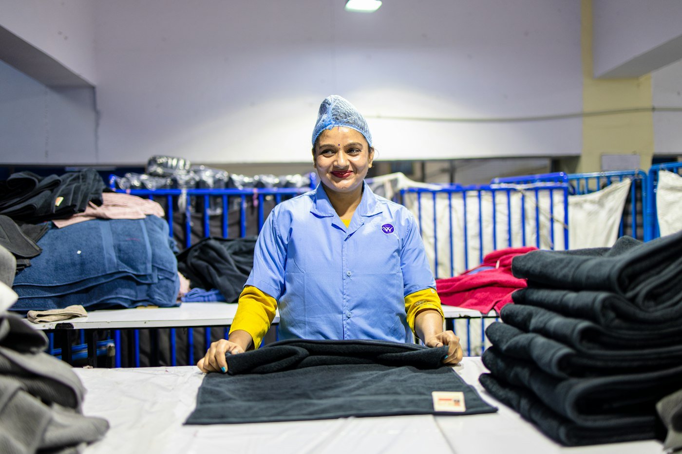 Seller folding clothes and preparing Meesho orders for dispatch