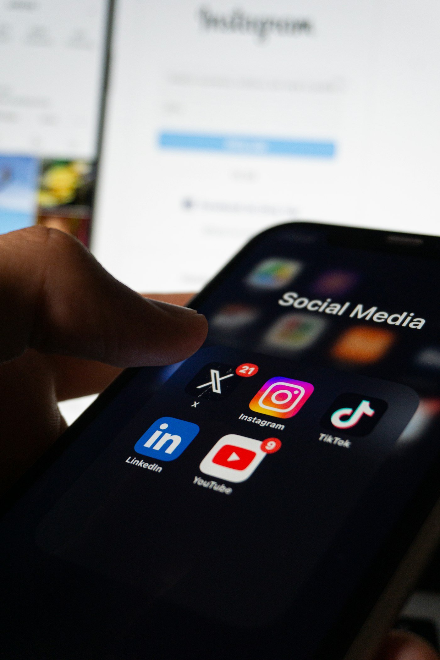 Person scrolling a social media feed where Meta ads reach new customers