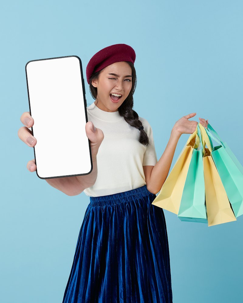 Customer shopping online on a tablet with shopping bags